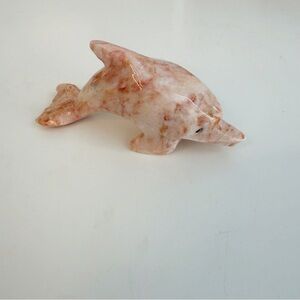 Alabaster stone marbled pink dolphin figure.